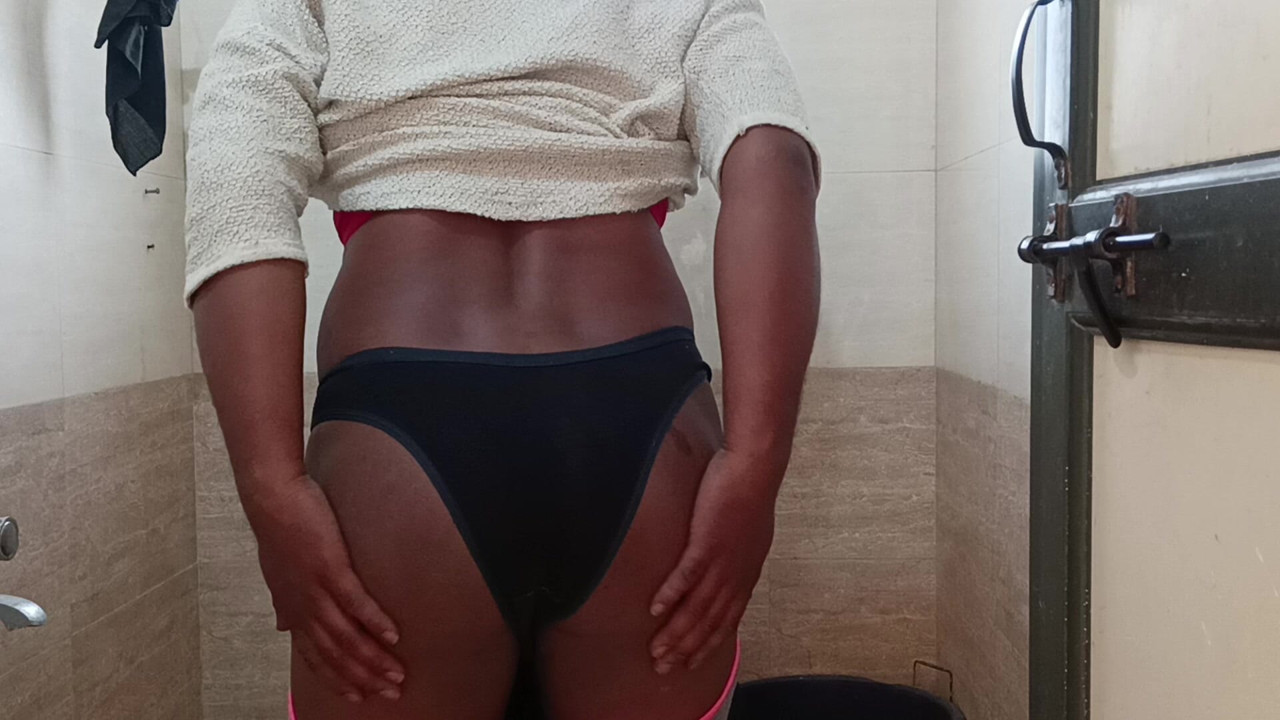 Indian boy wearing bra and panties in batharoom.