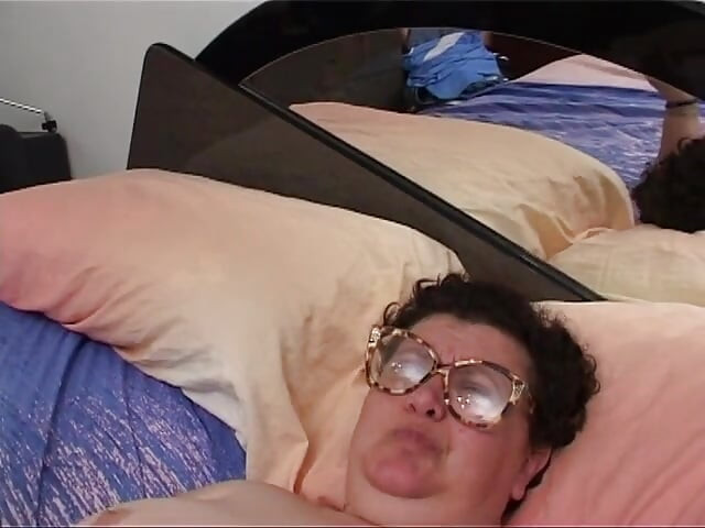 Old fat woman has solo sex in her bed with a dildo