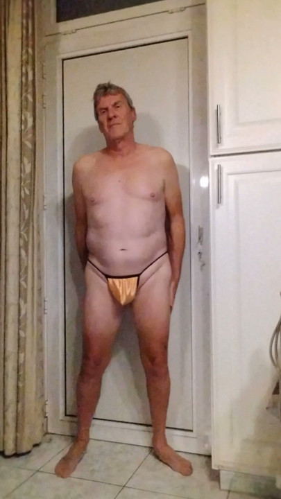 I show myself in a tiny yellow thong.