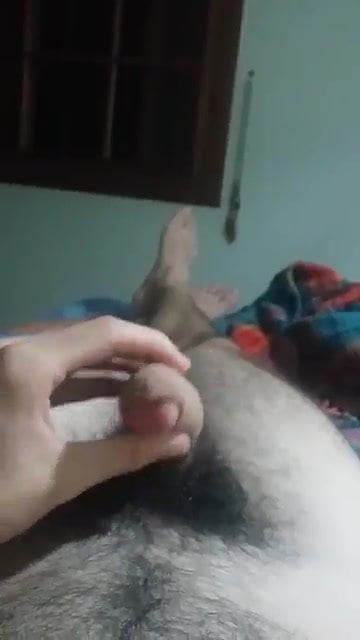 Hairy young guy cumming on his belly