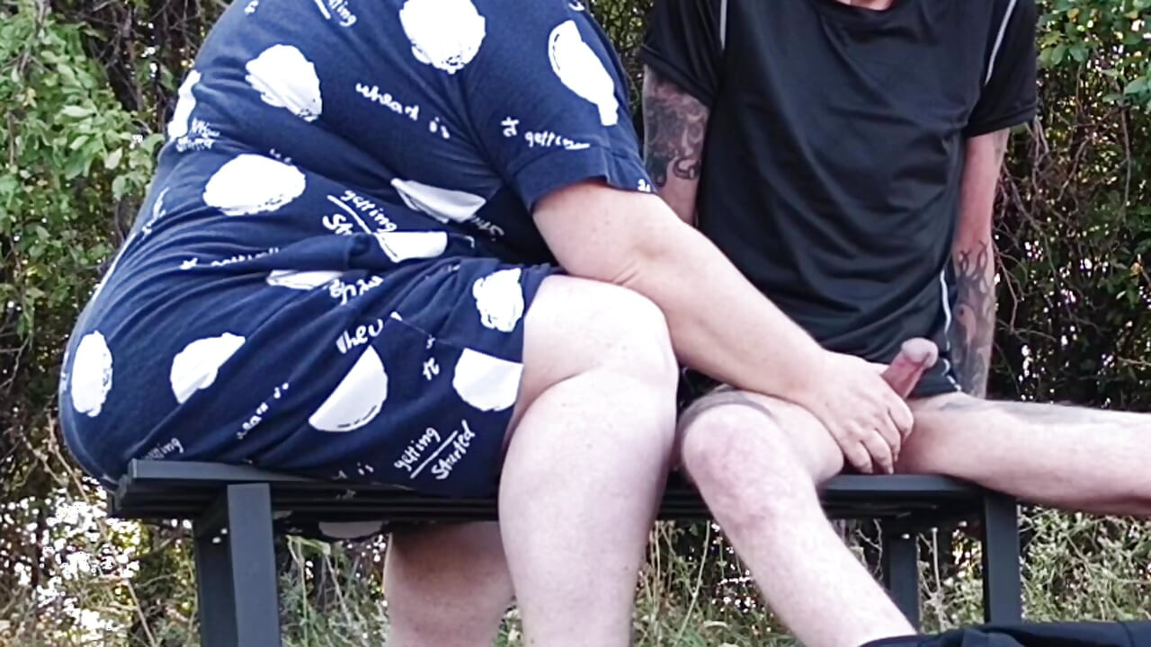 Stepmom in a public park fingering my dick on a bench