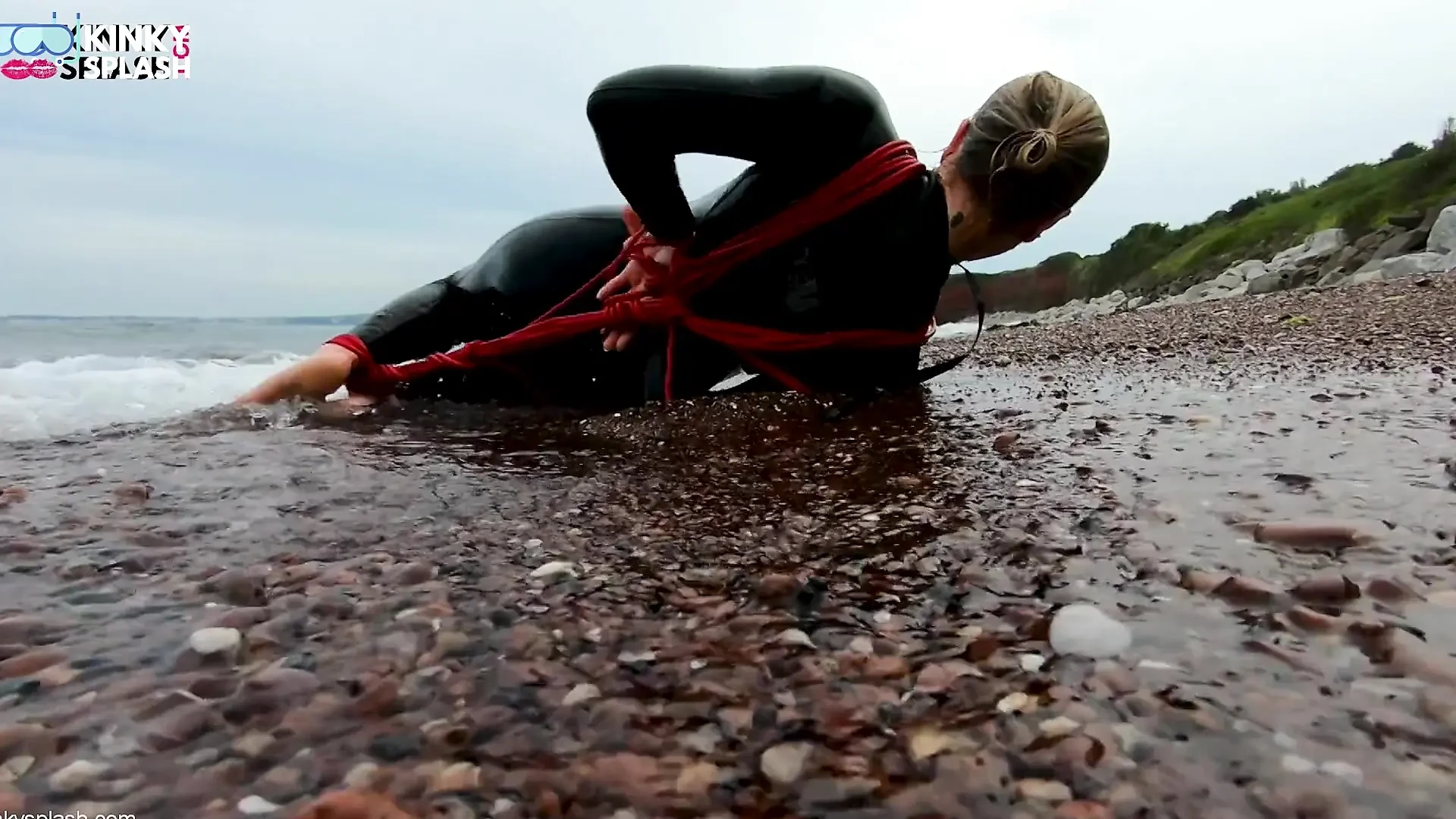 Hogtied in a Wetsuit – Rope Bondage Escape Challenge on the Beach