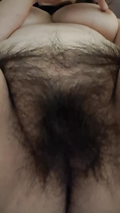 MILF admiring her fat, hairy pussy
