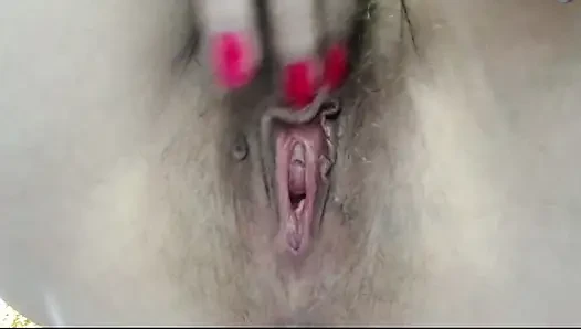 Her fingers in her hairy cunt