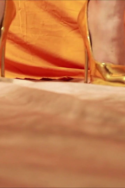 Giantess Shows off Gold High Heels