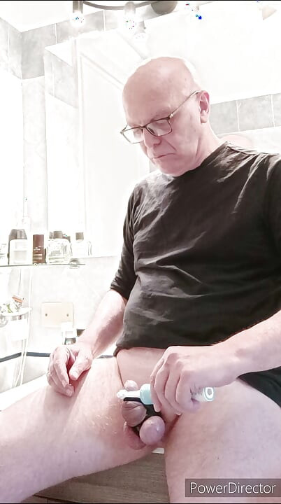 small caged cock and toothbrush