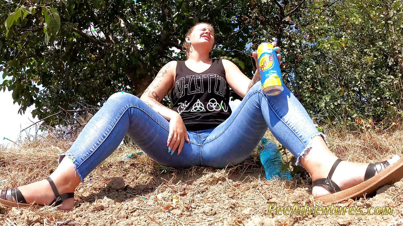Chubby girl talking on the phone with her boy friend pee in her jeans