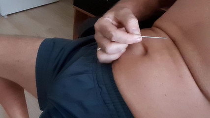 Sticking a linger needle in my Navel