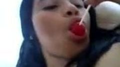 masturbating and licking lollipop