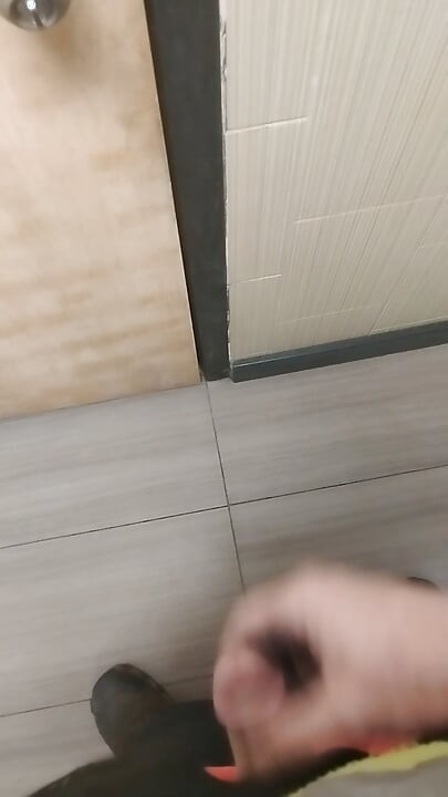 Jerking and cumming in public bathroom hallway