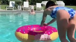 Lucy Hale jumping into a pool