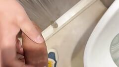 Getting caught playing with my curved dick in a public toilet