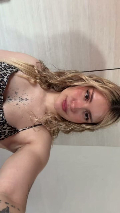 Pulling my leopard top down just for you