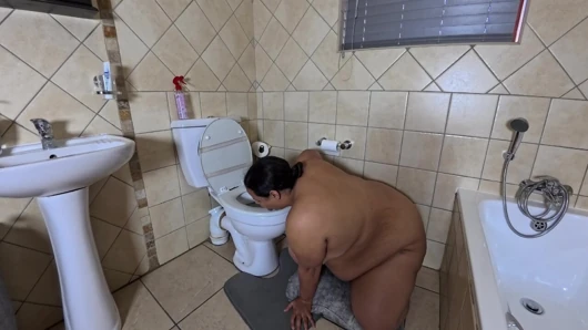 Playing with my fat pussy while licking the toilet