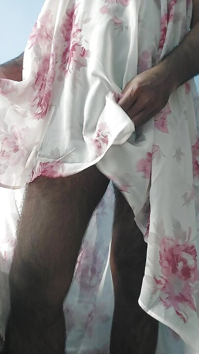 I'm masterbating in a flowery flowing silky seethrough fleard skirt and cum