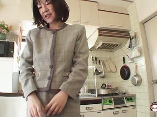 Makiko Nakane spreads her legs to show her pussy stuffed with cum after hard sex