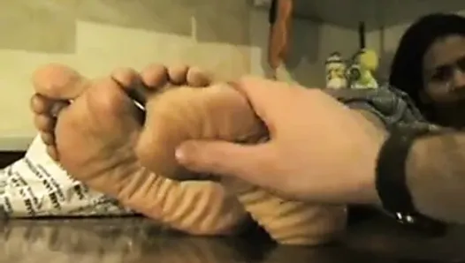 Asian lady with thick wrinkled soles