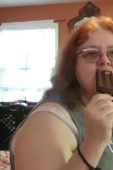 BBW nurse Vicki enjoys eatting a chocolate vanilla ice cream popsiscle