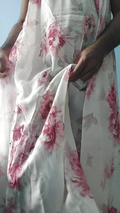 I'm masterbating in a flowery flowing silky seethrough fleard skirt and cum