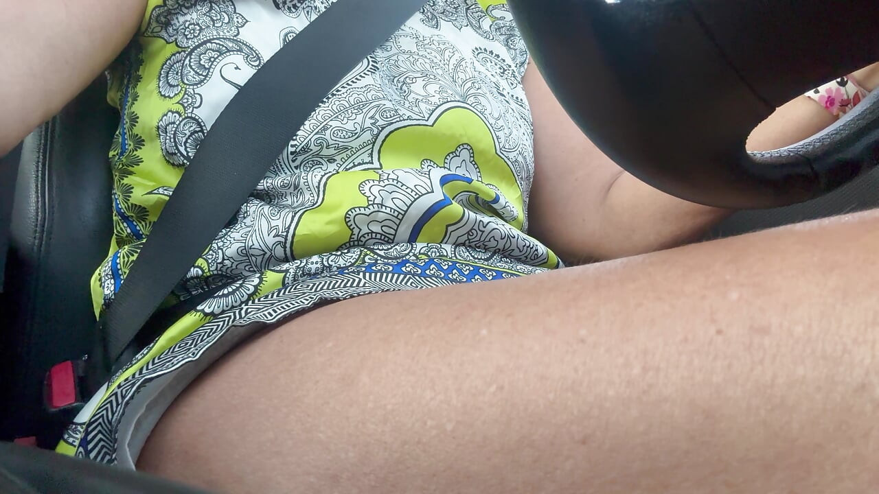 The beautiful and elegant stepmom Michelle drives to work in the morning.