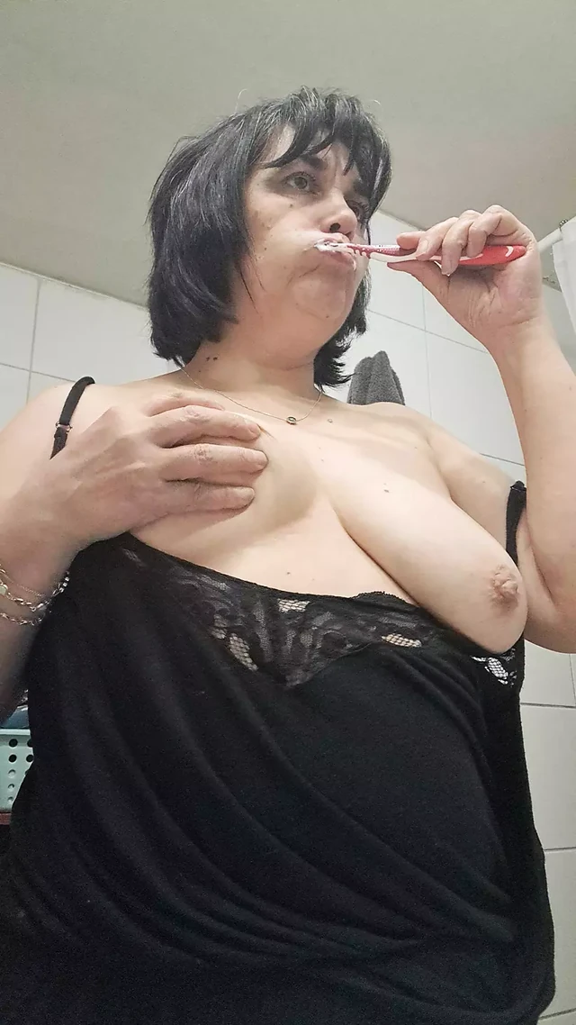 Brushing teeth and wet tits of mature milf