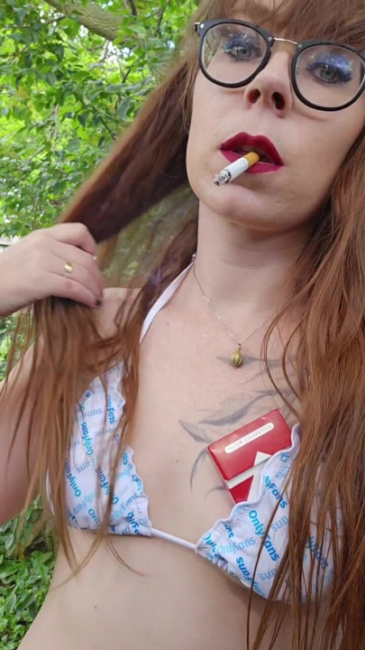 Bikini top redhead blows smoke in your face