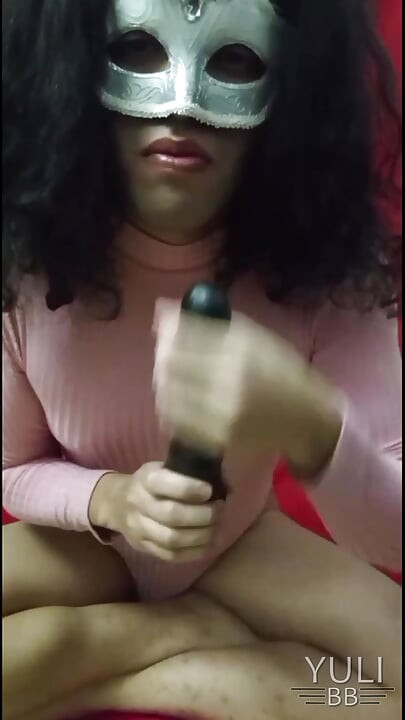Yuli plays uses her toy in her mouth and tail