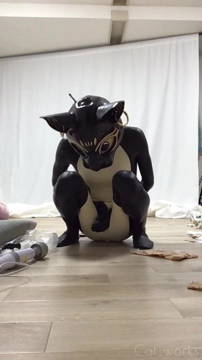 Rubber bastet cums in his latex catsuit with magic wand