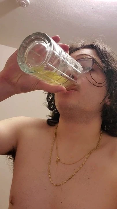 Drinking some nice yellow piss from a glass