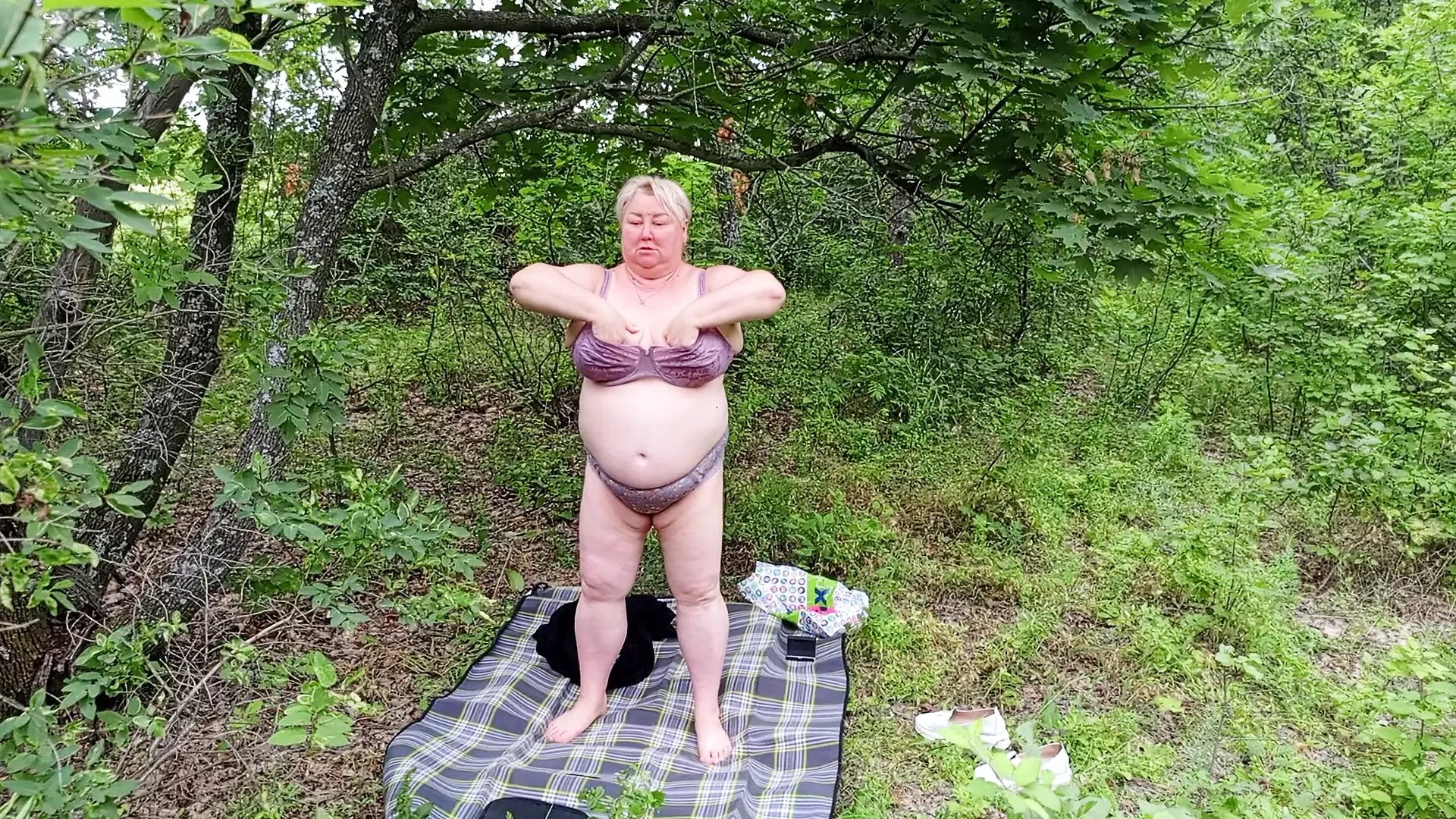 Neighbor undressed in a public park and masturbates her big pussy
