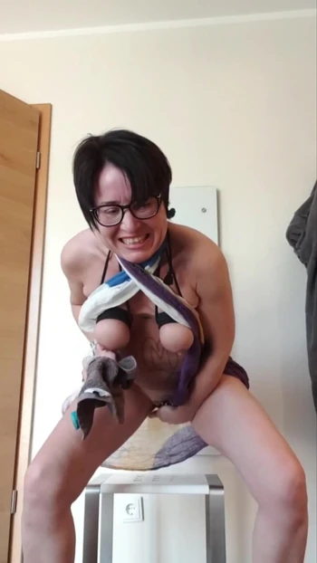 Captivating moment from "Milf Julie with anal dildo at window"