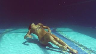 Heidi Van Horny with huge tits underwater