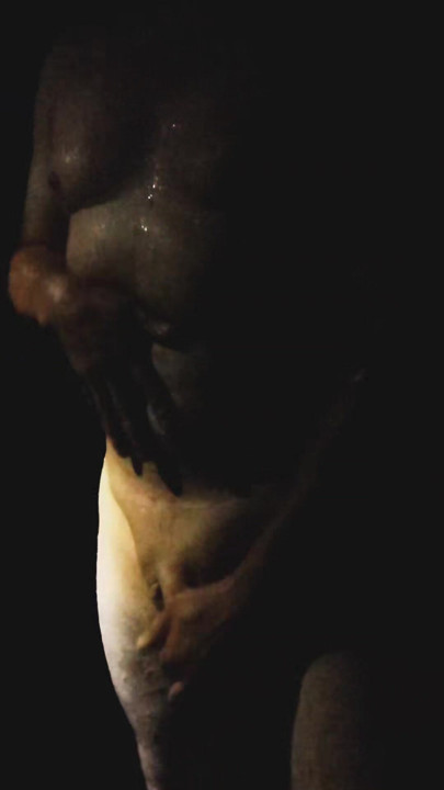 A sexy man washes in the shower and caresses himself and his beautiful penis.