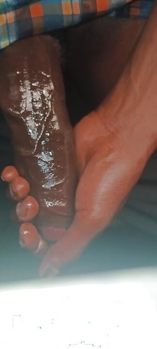 ChocolateMeatStick Putting On A Cock Ring Around His BBC With Oil