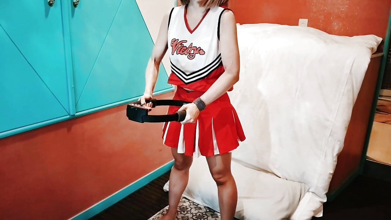 A cute, busty married woman does exercise 1 in an erotic cheerleader costume. Home made amateur Private Shoot