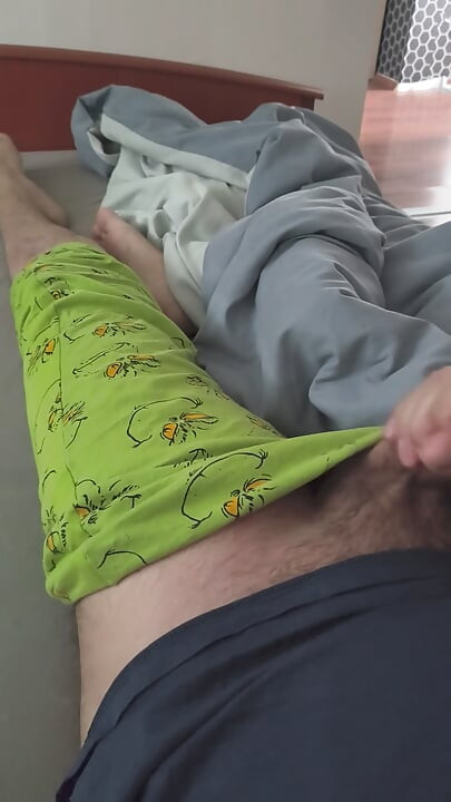 Cute handjob on the bed with a hard and erect penis