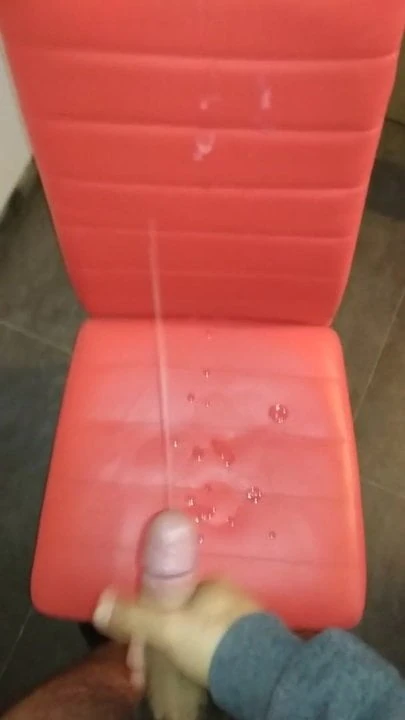 Cumming on a red chair