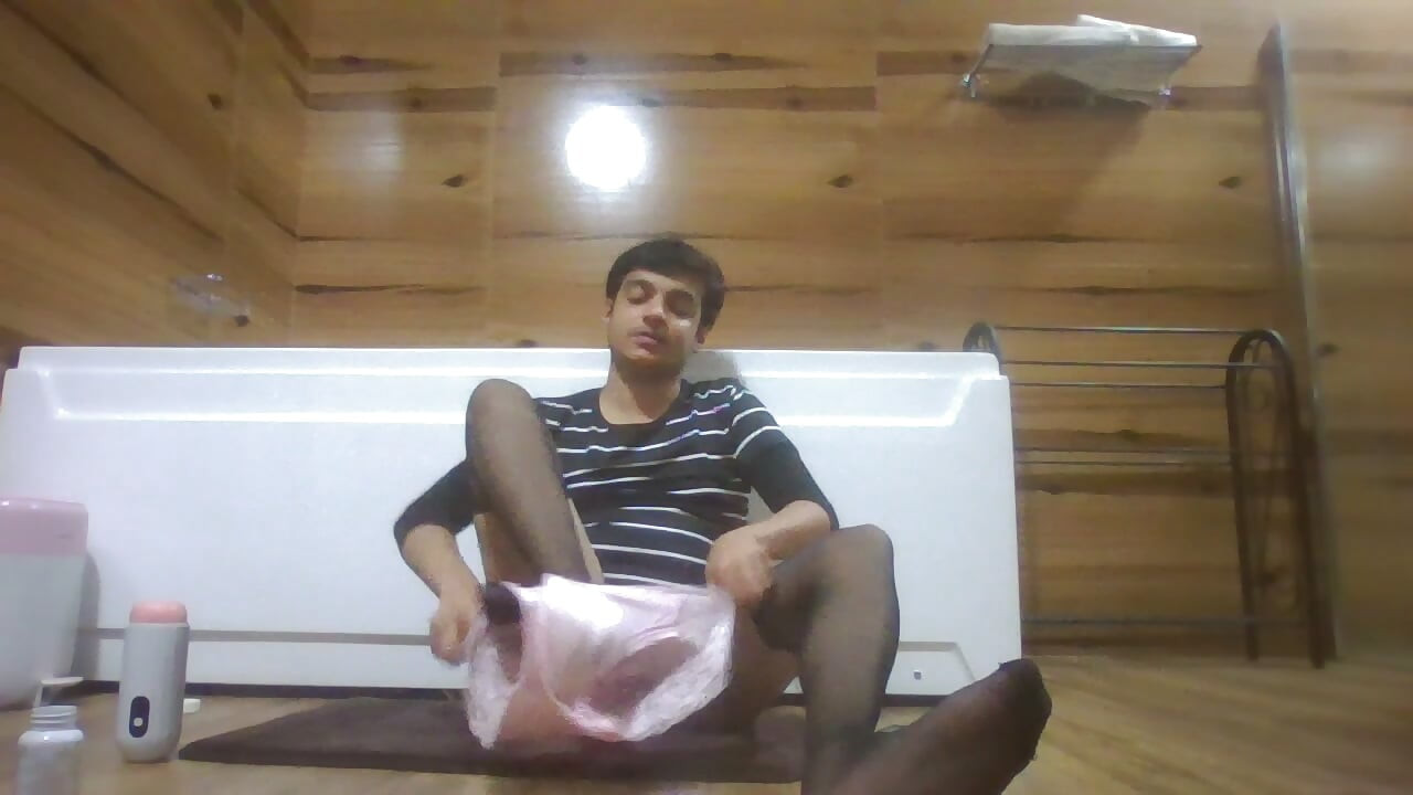 Sexy Sissy in Pantyhose Plays with Pocket Pussy while half naked and watching porn on her phone