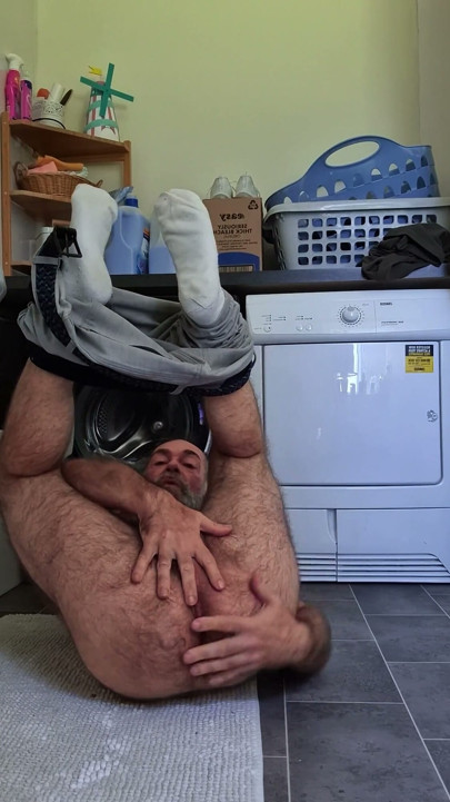 Hairy Bear Doing Laundry