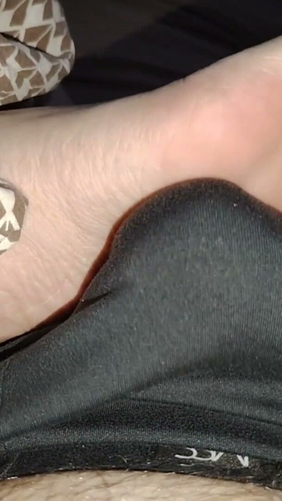 Stepsister's feet get a light massage while watching a movie | Clip 1