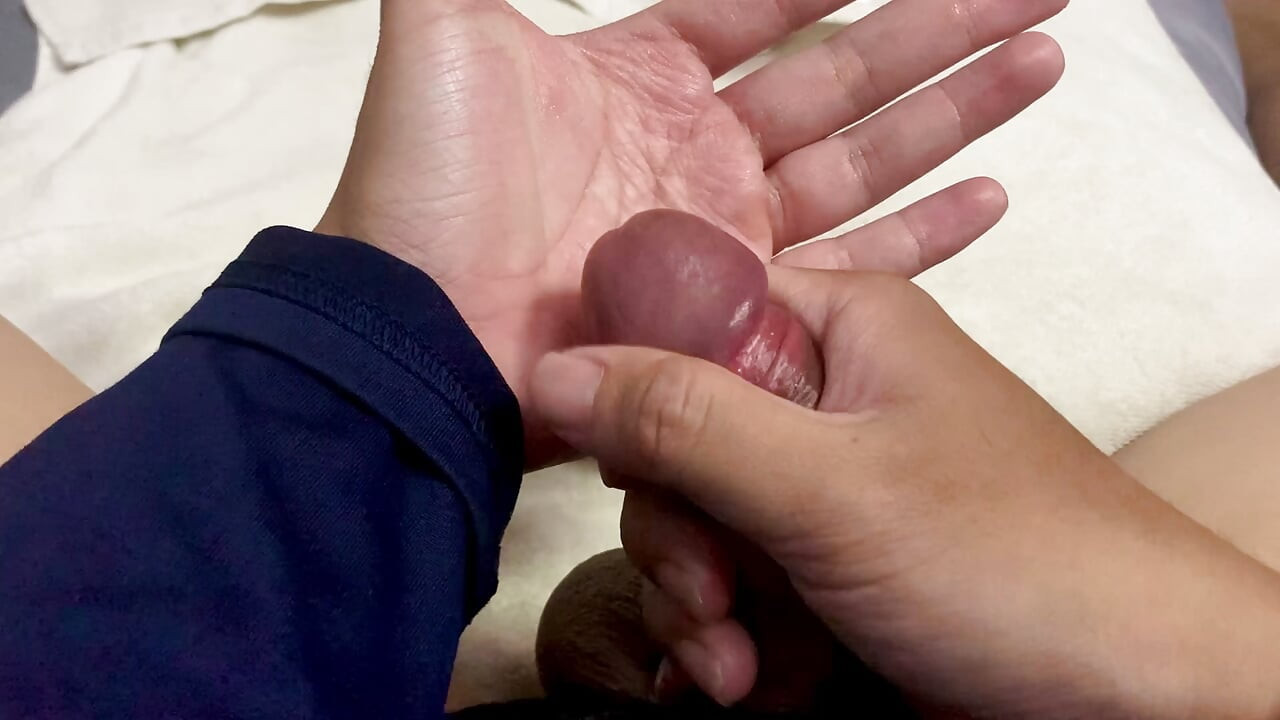 Asian guy sits handjobs cock and cums a lot
