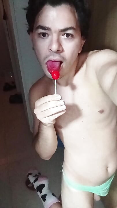 gay femboy sexy skirt lingerie and licking lollipop