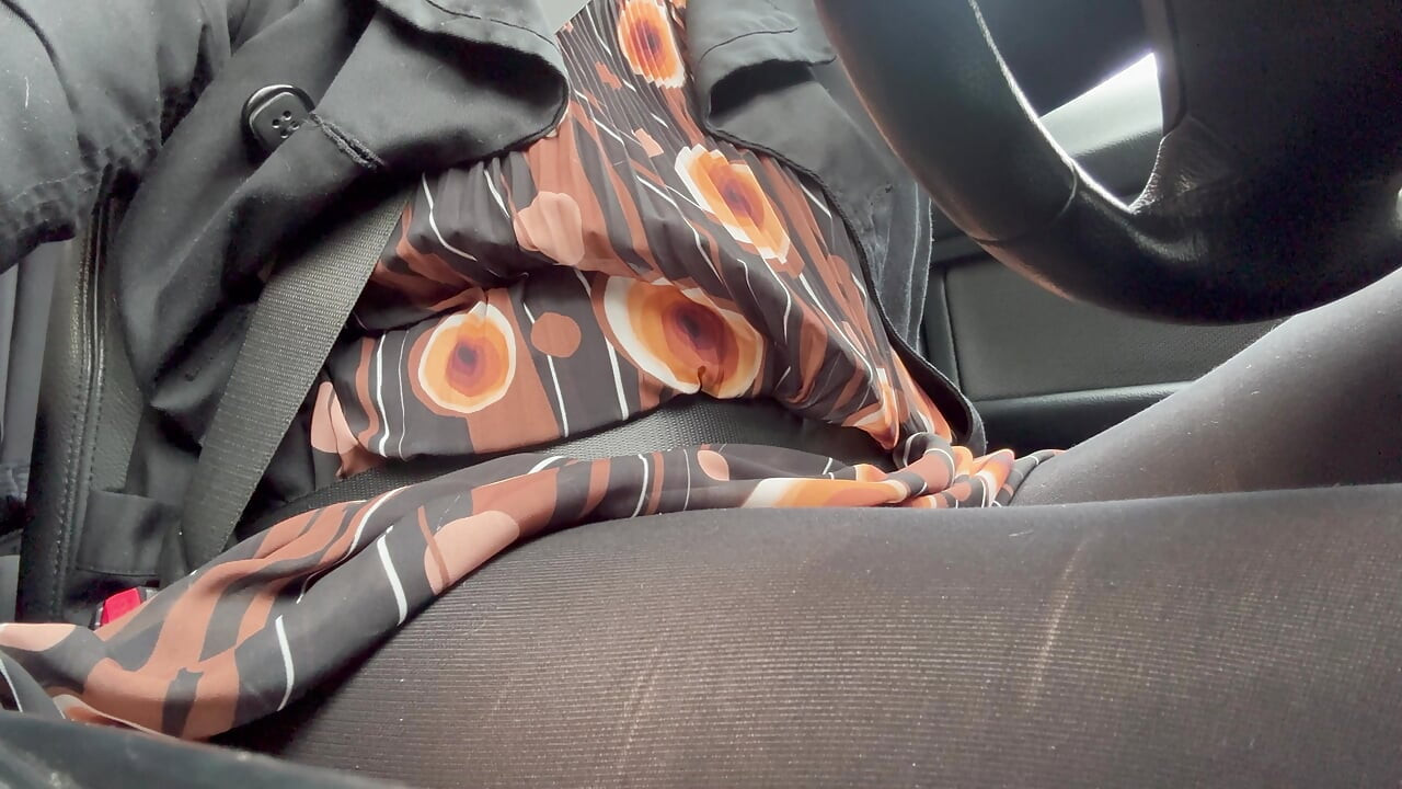 Elegant stepmom drives to the office wearing tights and a beautiful dress