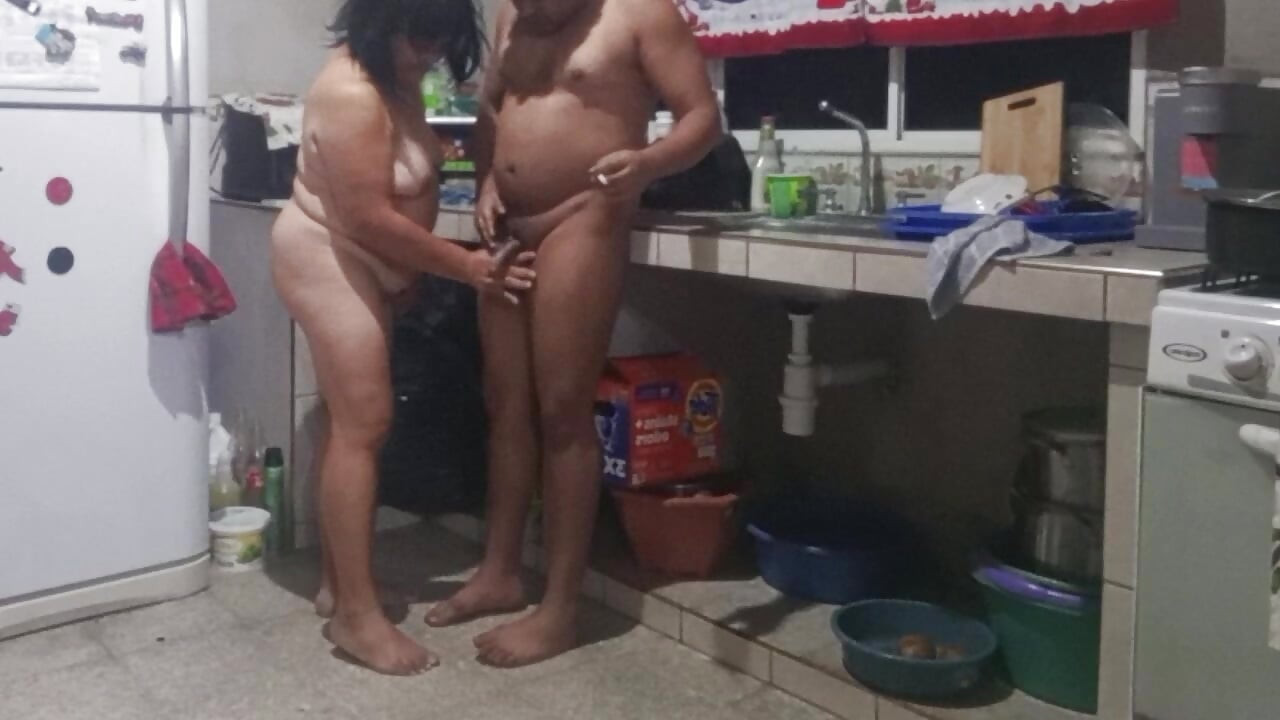 My mother-in-law masturbates me in the kitchen and wants me to fuck her doggy style.