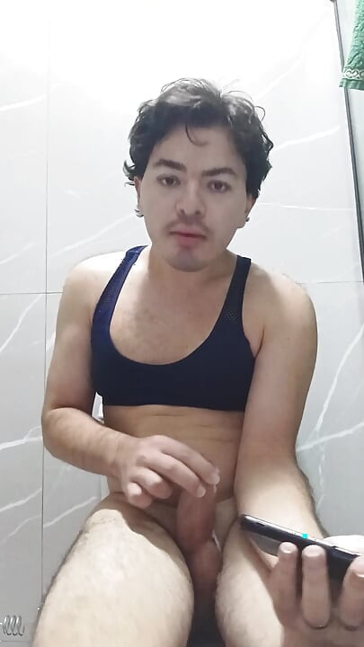 gay femboy sexy skirt lingerie and licking lollipop