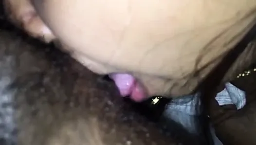 Thai girl sucking my dick and my balls and rimming my ass.