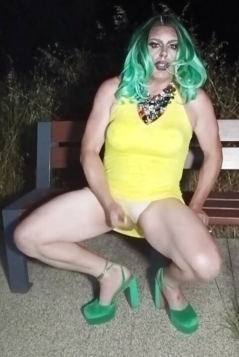 Sexy mature transvestite slut party summer showing off in a public park