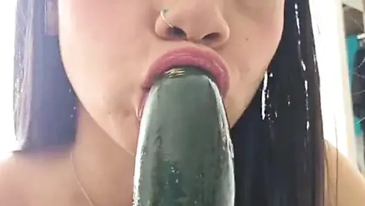 Playing with a delicious cucumber