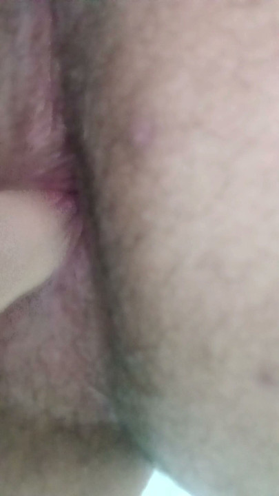 Scratching her ass with her fingertip