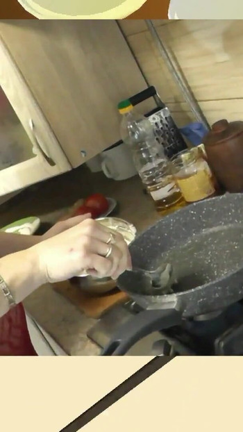 Emotional moment from "Sexy MILF continues cooking in kitchen naked without panties and bra in red transparent negligee."